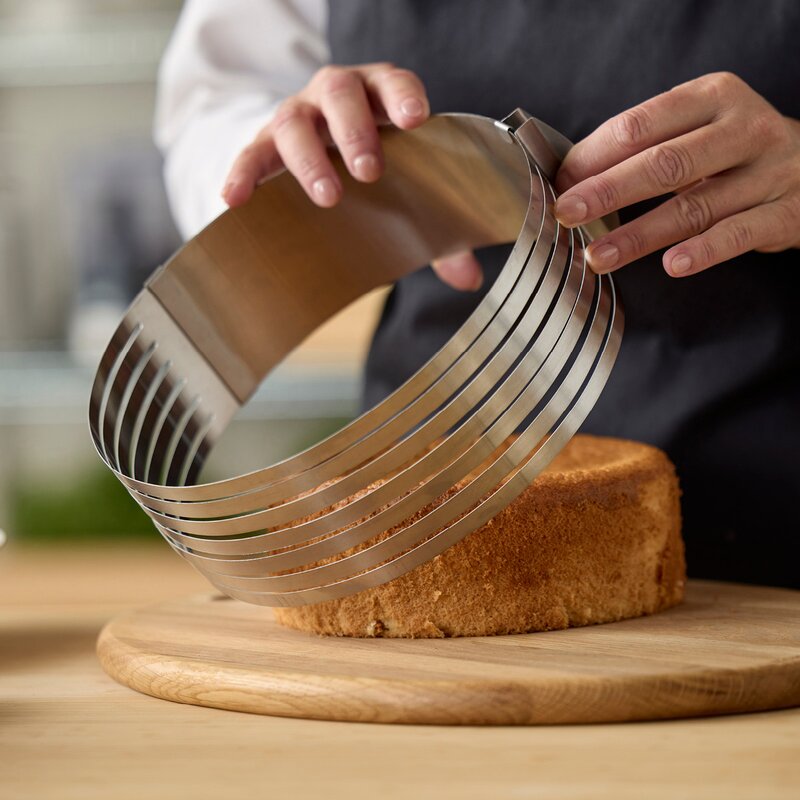 Justerbar kakedeler 24-30x8 cm stål